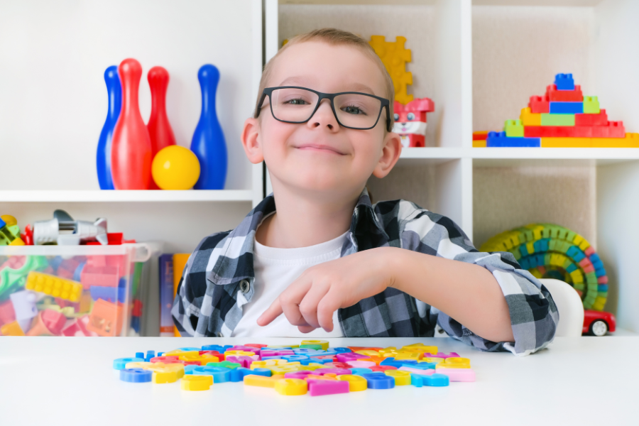 Kid with alphabet magnets